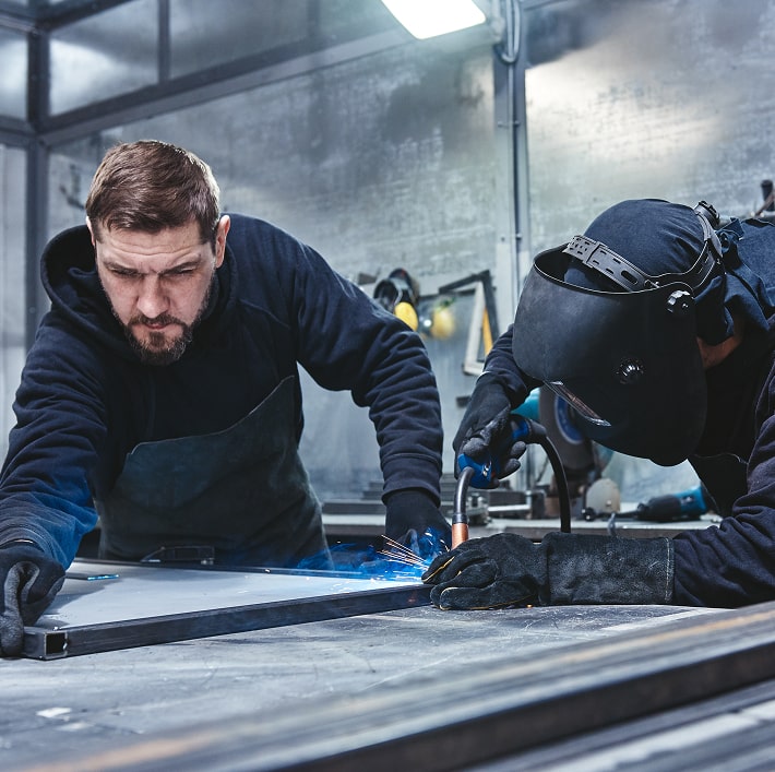 we-re-the-welders-welders-working-at-the-factory-min